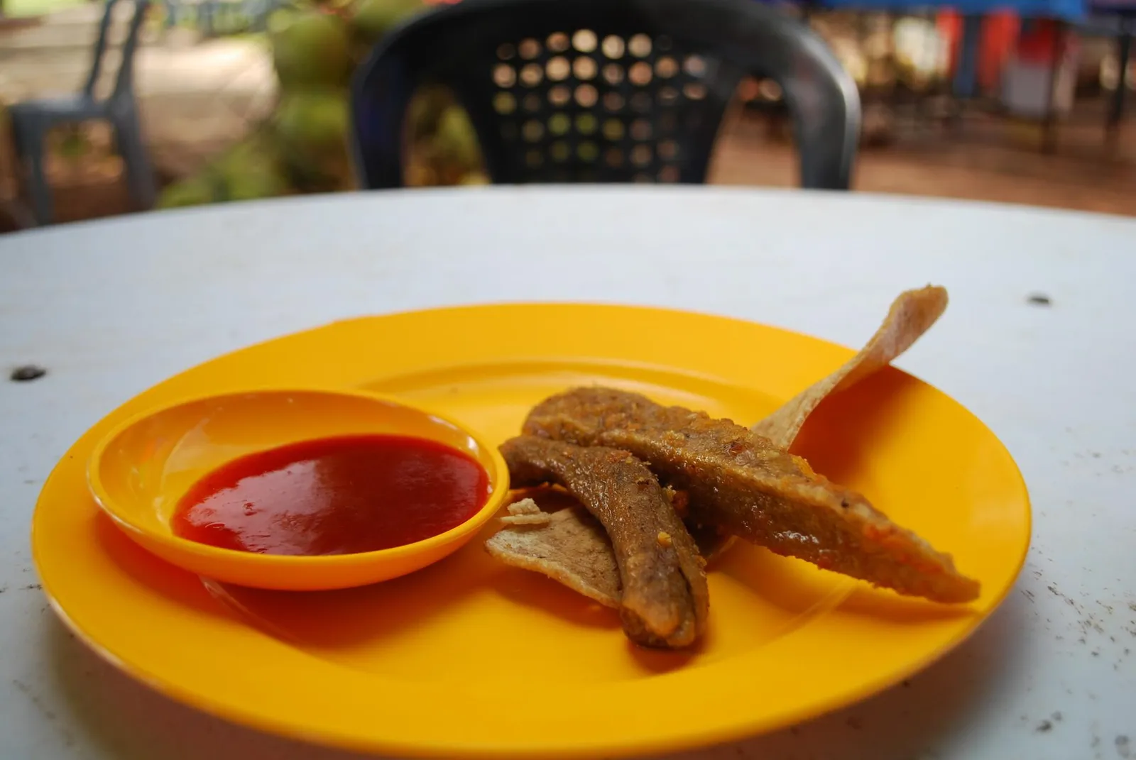 Keropok lekor with sauce, sold on some restaurant in Malaysia.