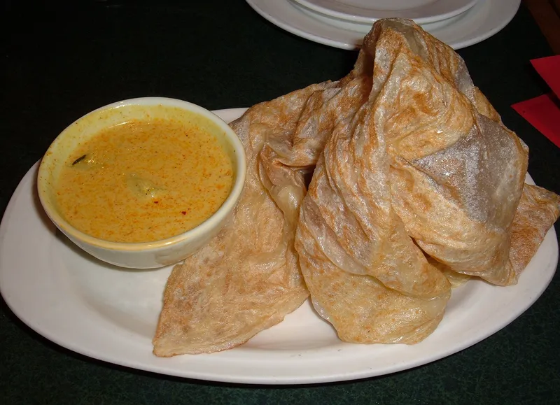 Roti canai with dipping sauce